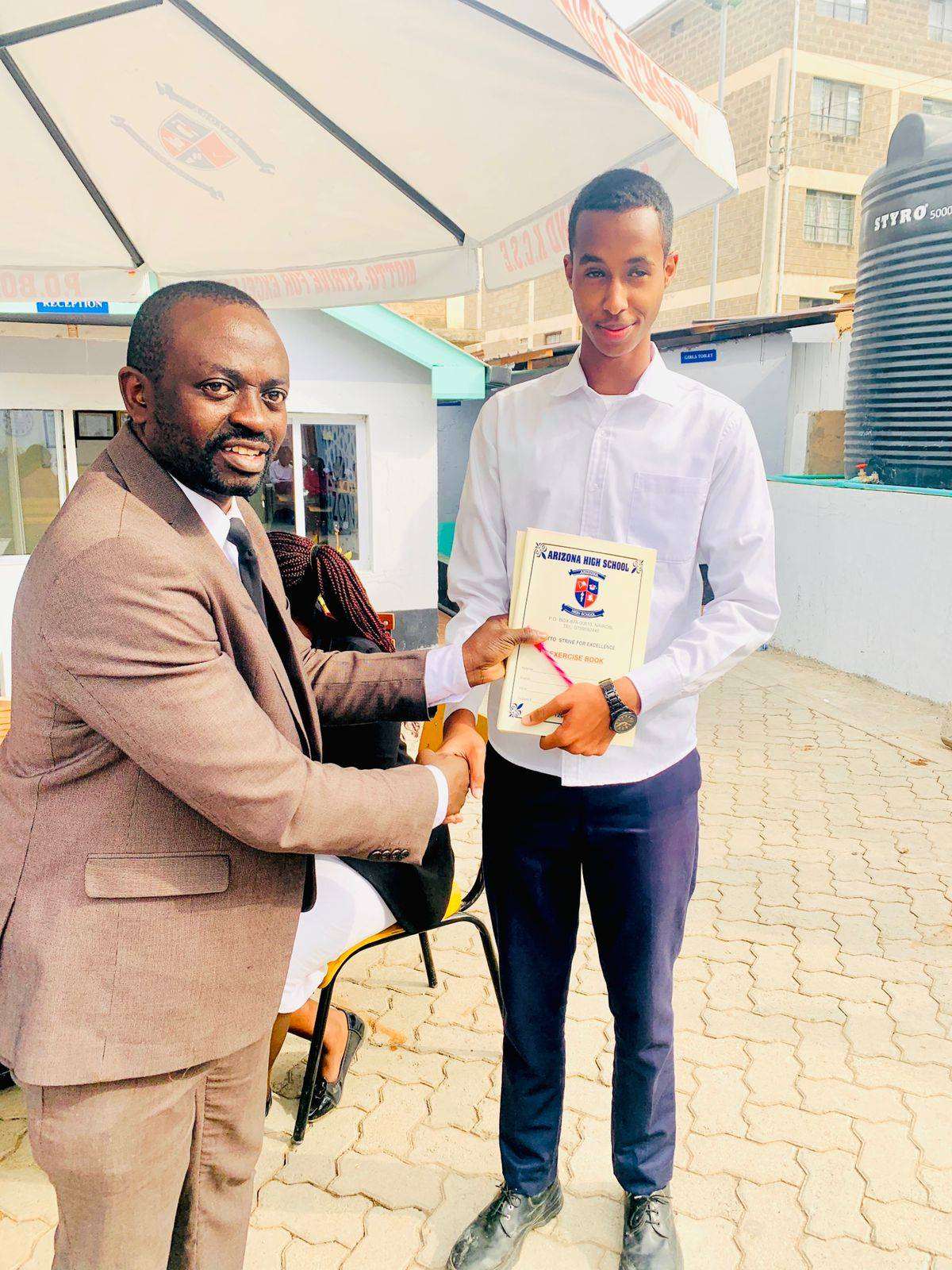 A student receiving an academic certificate at Arizona